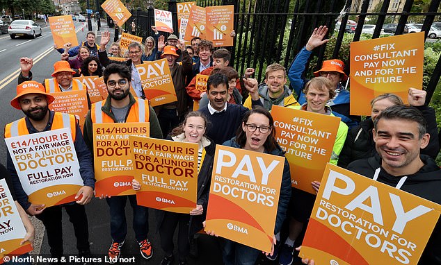 The British Medical Association (BMA), which is coordinating the strikes, says doctors have seen their wages fall by 35 percent over the past 15 years.  Pictured: Consultants and trainee doctors strike outside the Royal Victoria Infirmary in Newcastle on September 20