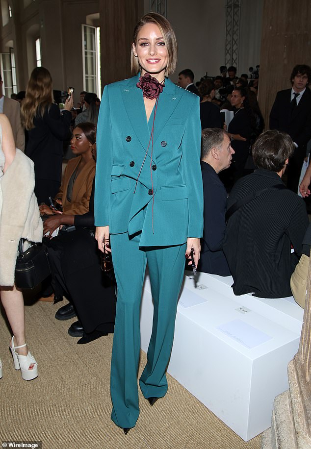 Stunning: Olivia Palermo, 37, turned heads in a blue power suit as she sat front row at the show