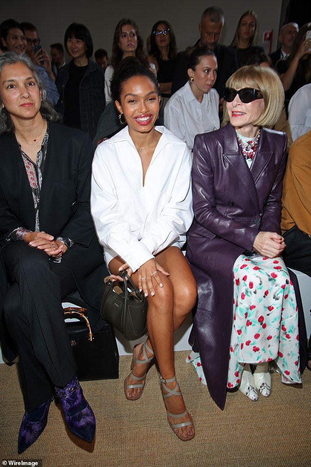 Star-studded: During the fashion show, Olivia sat next to Vogue editor-in-chief Anna Wintour, 73, who dressed to impress in a white patterned maxi dress