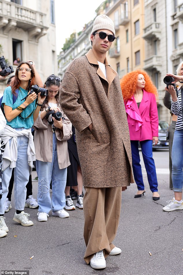 Coordinated: Elsewhere, Jacob Rott looked effortlessly cool in a brown long jacket worn over a white T-shirt and matching corduroy trousers