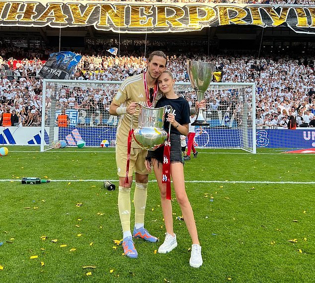 The pair we saw earlier in the photo celebrated their title success on the pitch in Copenhagen