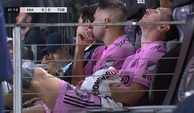 Messi looked distraught as he sat on the bench after being taken off the pitch due to muscle fatigue