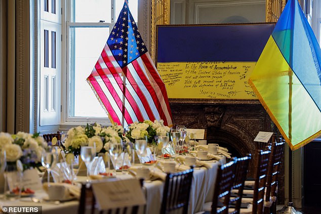 A framed flag, signed by Ukrainian fighters on the front lines in Bakhmut and presented to the US Congress in 2022, sits at one end of the table where Ukrainian President Volodymyr Zelenskiy will meet privately with Speaker of the House of Representatives Kevin McCarthy and other leaders.