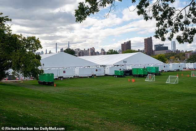 Officials in Chicago have said they will build tent shelters for migrants like those in New York City.  The migrant camps set up on New York's Randall's Island can be seen above