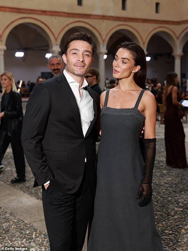 In love: Amy has been seen in many outfits during MFW, with her latest outfit at the Coccinelle event with her boyfriend Ed Westwick (pictured at the Alberta Ferretti show)