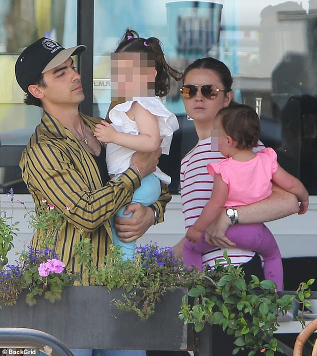 The couple was married for four years and share daughters, three-year-old Willa and one-year-old DJ.  The photo shows Jonas with his two daughters earlier this month