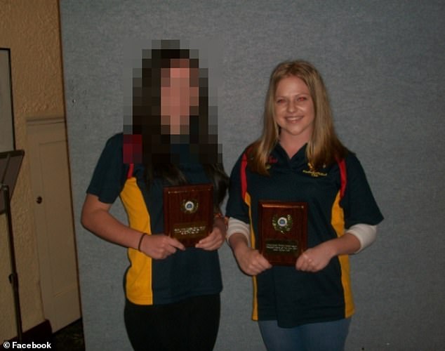 Heffer is pictured receiving the Badged Umpire of the Year award from the Central Murray Football Netball League circa 2011