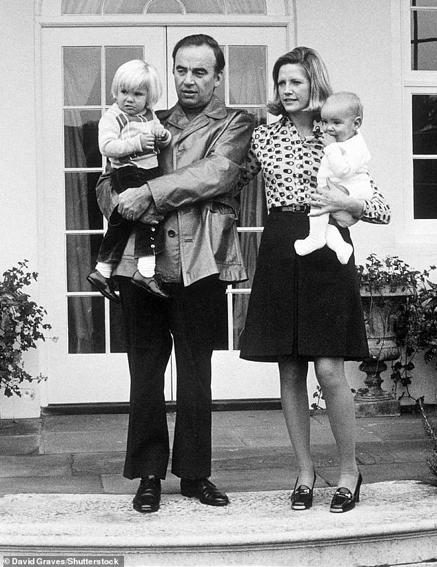 Lachlan is seen as a young boy with his parents and younger brother