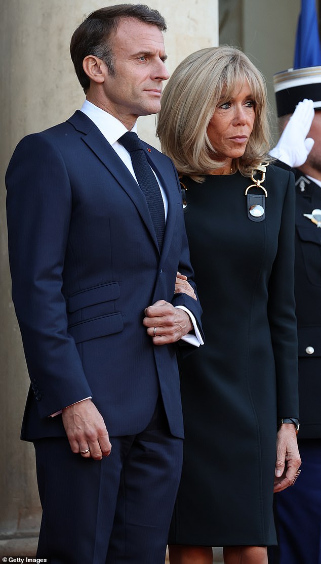 President Emmanuel Macron and Brigitte Macron are seen welcoming the royal family to the palace