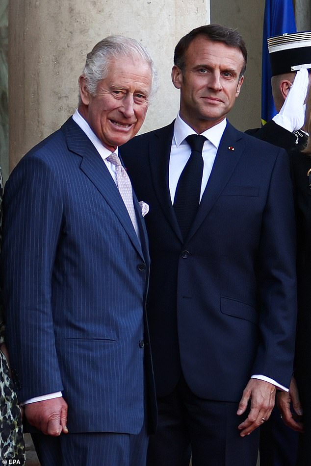 France's inveterately tactile president, Emmanuel Macron, put his arm around him and patted his back