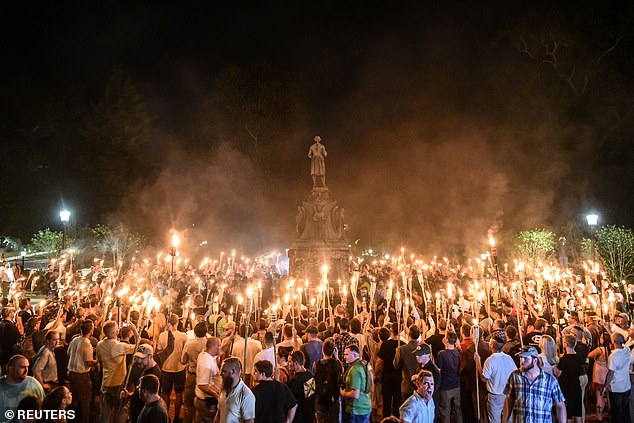 White nationalists participate in a torch-lit march on the grounds of the University of Virginia prior to the Unite the Right Rally in Charlottesville, Virginia on August 11, 2017