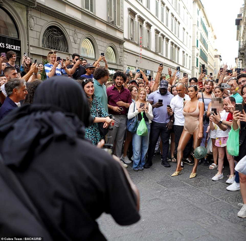 She showed off her sensational figure in a skintight nude leotard, styled with shiny tights and pointy kitten heels