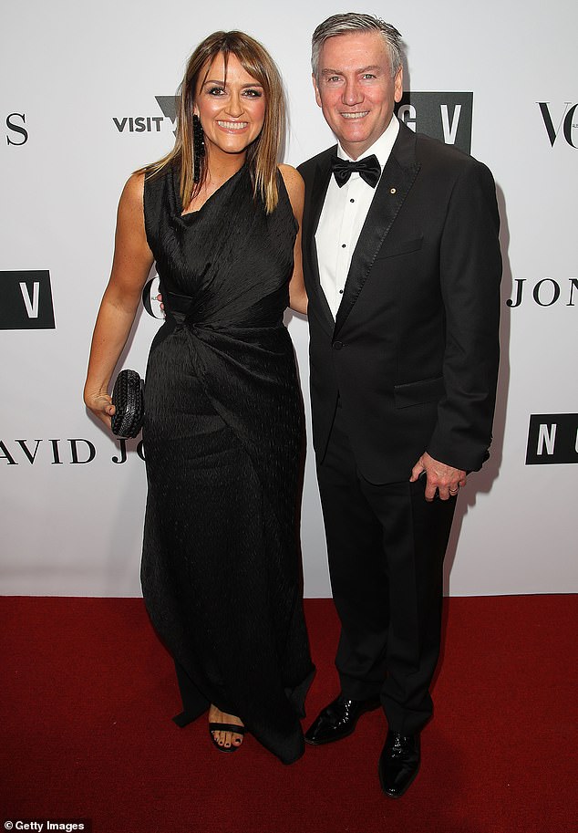 McGuire was given a black and white jersey with the number 22 to symbolize his years as president of the Magpies club (pictured, with wife Carla)