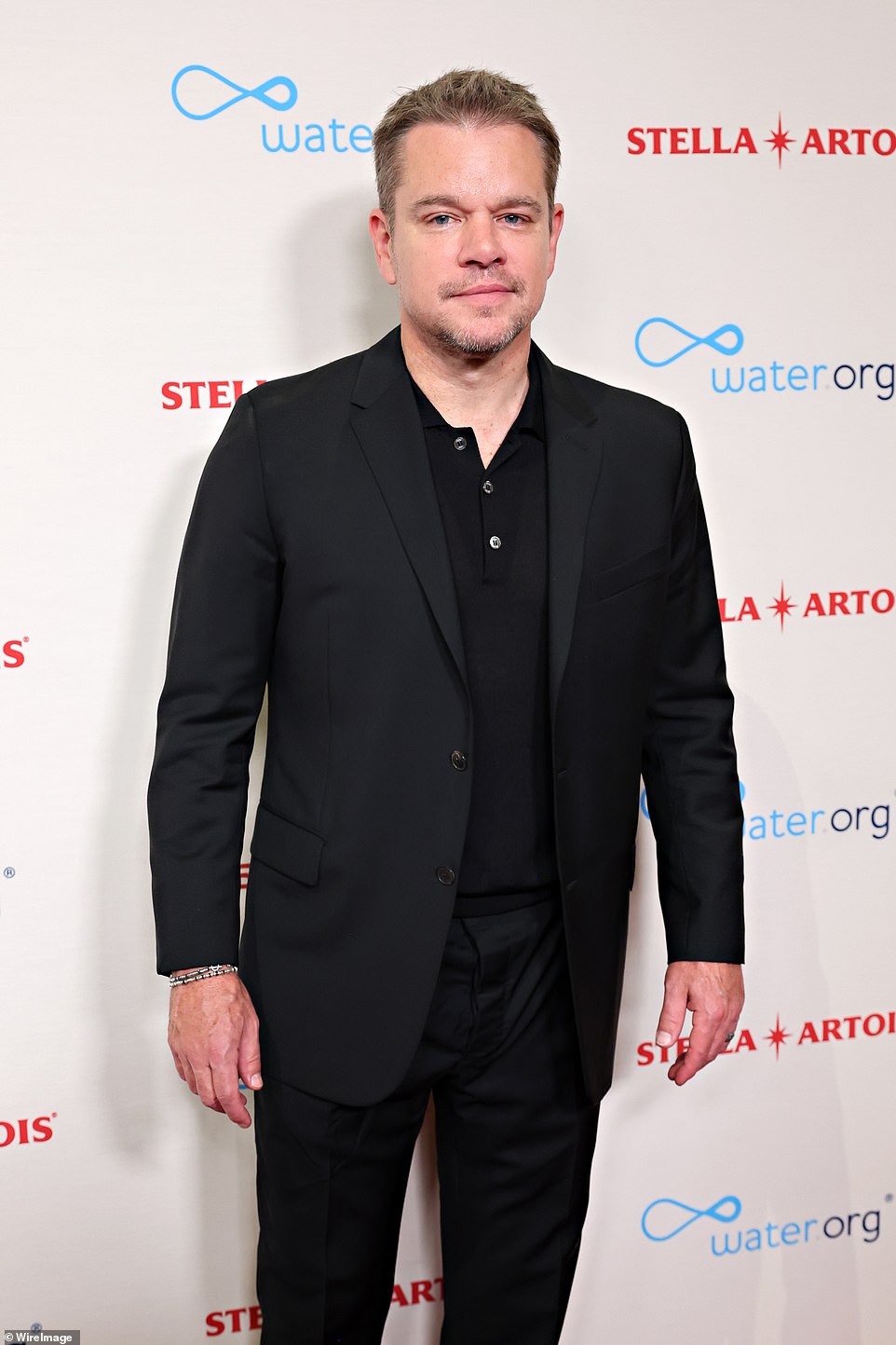 His look: Matt looked typically handsome in a black suit, worn with a casual black polo sweater