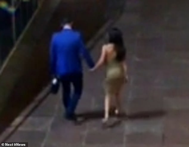 The two were seen holding hands as they left the area and walked down the street