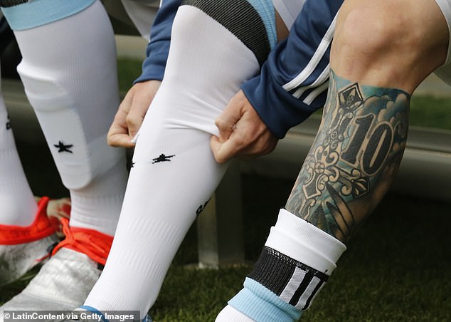 Messi had another tattoo on his left shin and calf before blackening it in later years