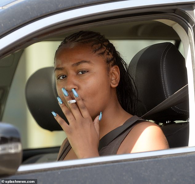 The USC graduate was also spotted puffing on a cigarette while donning a crop top and bright green sweatpants during a recent solo visit to the spa