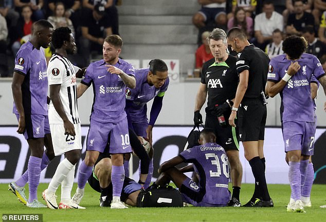 The 21-year-old (center of floor) received treatment before limping off in the 71st minute on Thursday