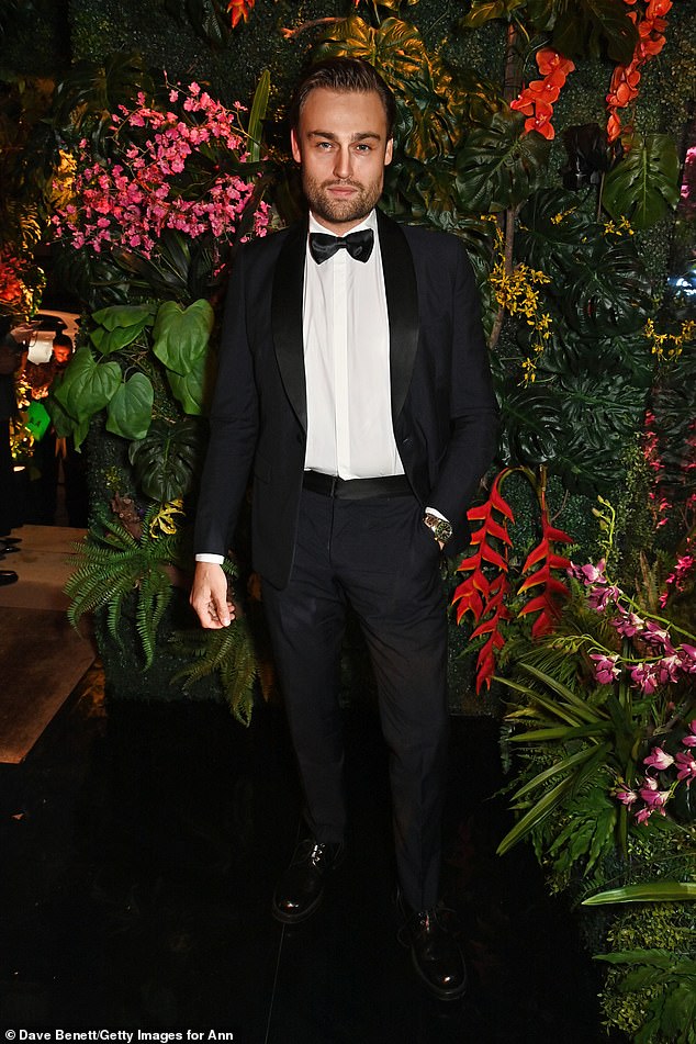 Handsome: Douglas Booth opted for a stylish black tuxedo with bow tie