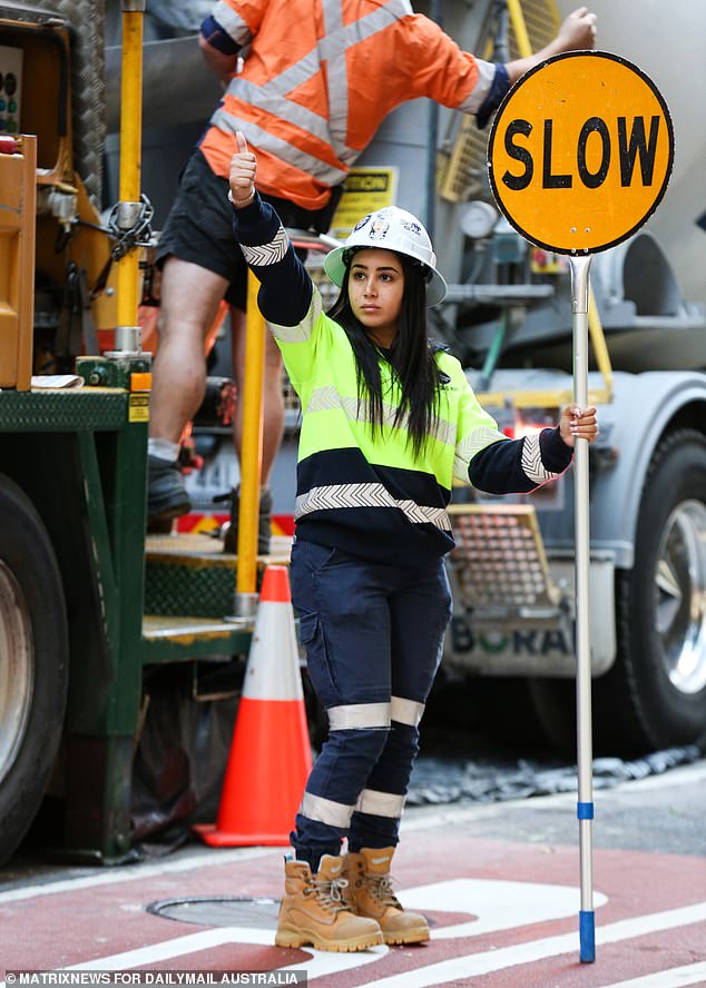 A Reserve Bank paper released on Friday raised fears that poor productivity would hurt Australian consumers, who have already faced 12 interest rate hikes since May 2022 (pictured is a traffic controller in Sydney)