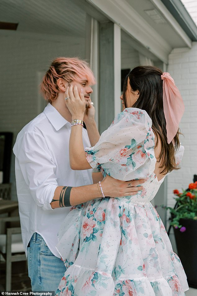 Matching his wife's colors with a white button-down and blue jeans, the Australian musician dyed his hair pink for the happy occasion