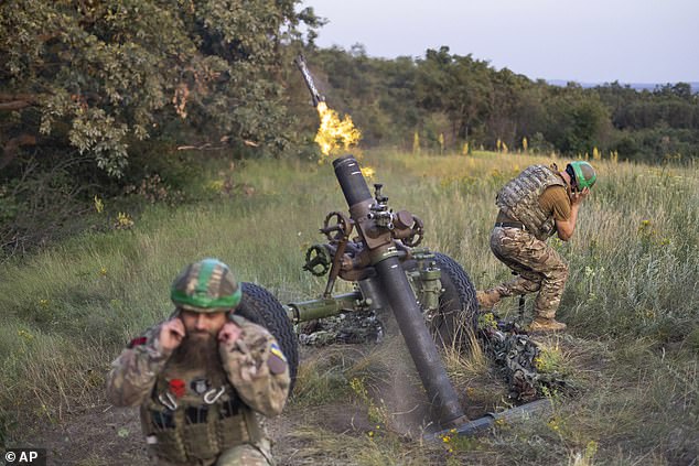 Ukrainian soldiers from the 3rd Assault Brigade fire a 122mm mortar at Russian frontline positions, near Bakhmut, Donetsk region, Ukraine, Sunday, July 2, 2023