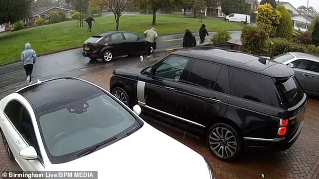 The gang is seen on the run after stealing a Rolex, two sets of car keys and expensive jewelery including two bracelets, a chain and two pendants