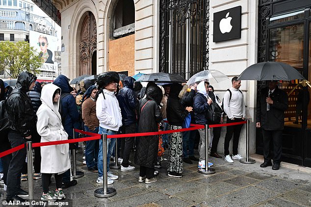 PARIS: Customers queue outside an Apple Store in Paris, France