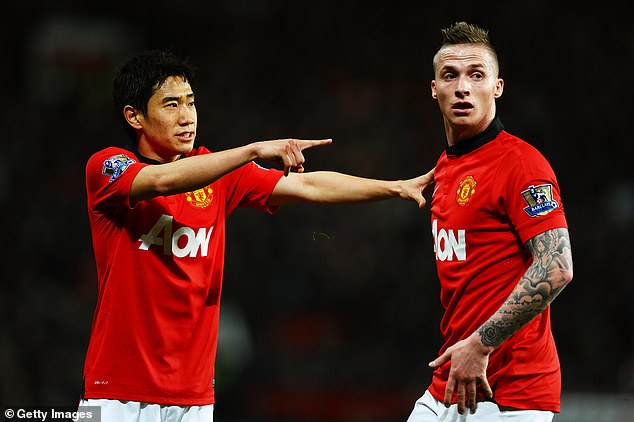 Shinji Kagawa (left) is Japan's only flag bearer, while Alexander Buttner is one of fourteen Dutch