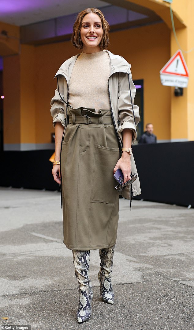 Star-studded: Teaming up with Sharon, Olivia Palermo delivered stylish displays for the fashion show, pairing a khaki paper bag skirt with a beige funnel-neck top