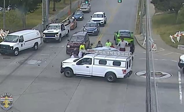 After Louisville football players turned over an overturned vehicle