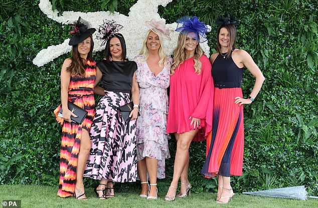 Stunning dresses were paired with elaborate fascinators, sky-high heels and plunging necklines as racegoers dressed up in green, pink and orange