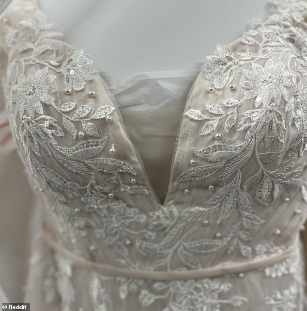 Posting on the Wedding Dress subreddit, she said her mother made the change so the dress wasn't so revealing.  Pictured is the dress before it was altered