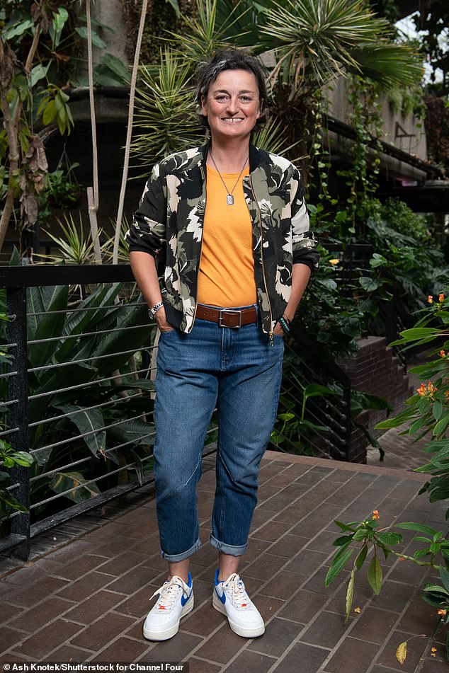 Daring: Comedian Zoe stood out from the crowd in a bright orange T-shirt, under a green patterned jacket