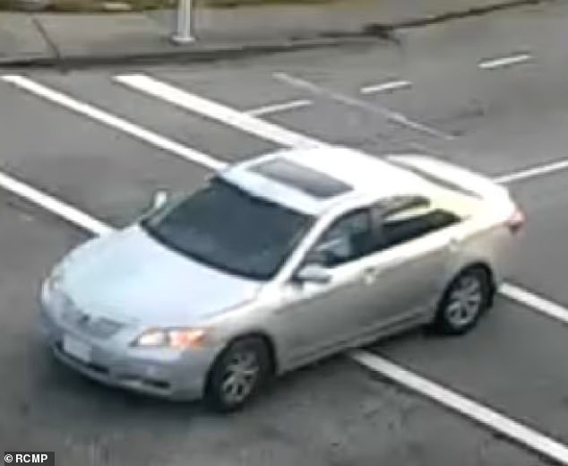 Police say two gunmen escaped in this silver 2008 Toyota Camry driven by a third accomplice