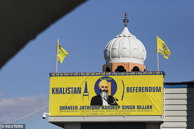 A banner depicting Sikh leader Hardeep Singh Nijjar is seen at the Guru Nanak Sikh Gurdwara Temple, the site of his assassination in June 2023, in Surrey, British Columbia