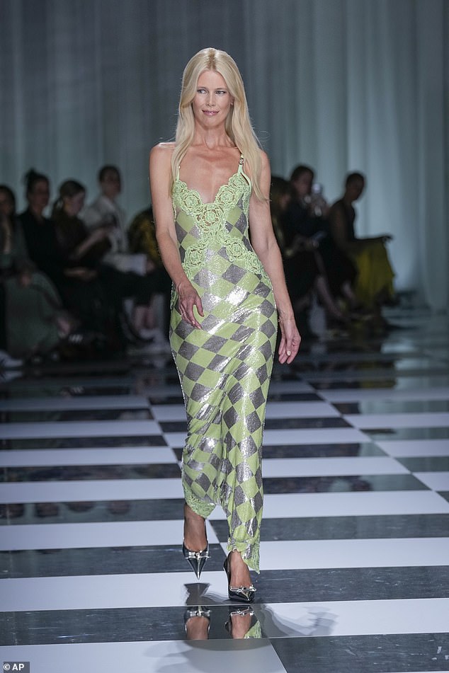 Strut: The show saw Versace debut its Spring/Summer 2024 collection and saw iconic supermodel Claudia Schiffer, 53, make her long-awaited return to the catwalk