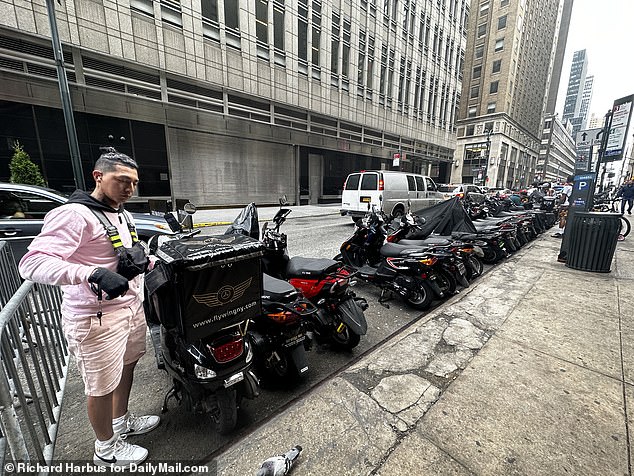 The migrants living in the shelter have been working illegally as delivery people and using dozens of unmarked scooters, which have become a common sight outside the iconic location