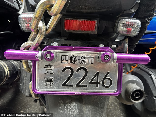 A scooter with what appears to be a foreign license plate is seen outside the Roosevelt Hotel shelter