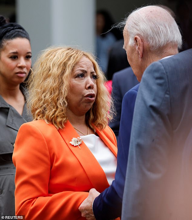 Rep. Lucy McBath (D-GA), whose son, 17-year-old Jordan Davis, was reportedly shot and killed over loud music in 2012, talks with U.S. President Joe Biden after an event announcing the creation of a new White House Office of Gun Violence Prevention