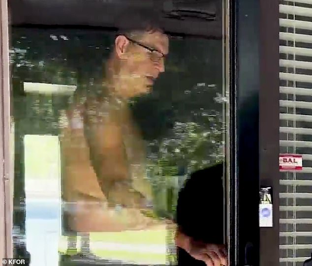 Judge Lovell answered the door shirtless when approached by a local news reporter