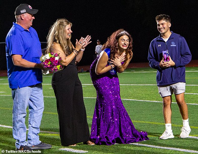 Young celebrated her coronation with her family (pictured) as she burst into tears