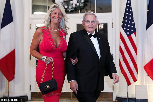 Senator Bob Menendez (D-NJ) and his wife Nadine Arslanian arrive for a state dinner honoring French President Emmanuel Macron at the White House in December 2022;  the couple has been charged with three crimes related to bribery and extortion