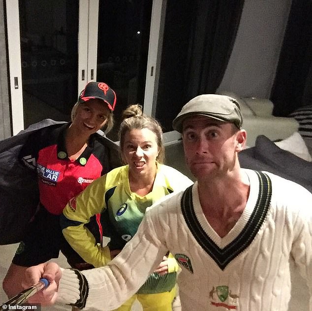 Jeremy Howe dressed in Australian Test Cricket gear with his wife Kahlia Ashton (centre) and Bec Wade, wife of Matthew Wade