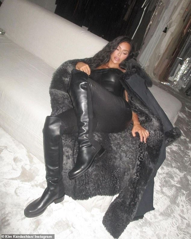 She's a beauty: She also posed in a furry black coat with her hands on her waist