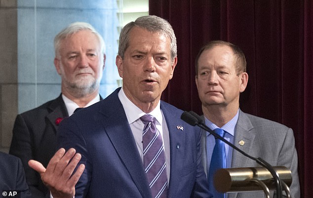 Nebraska's abortion limit was lowered from 20 to 12 weeks earlier this year, in a bill signed by Republican Nebraska Governor Jim Pillen (pictured center)