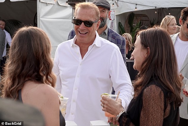 Cheerful: The Yellowstone star appeared to be in good spirits as he flashed a big smile at the event that attracted celebrities as well as local police and firefighters