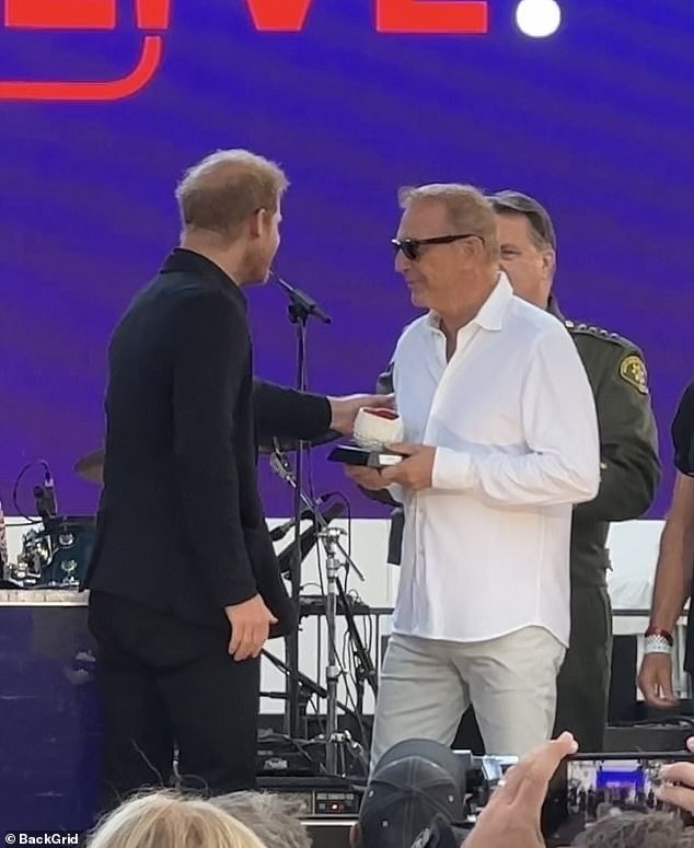 Honored: Costner also received an honorary award at the event, which was presented by Prince Harry and his wife Meghan Markle, who were also in attendance