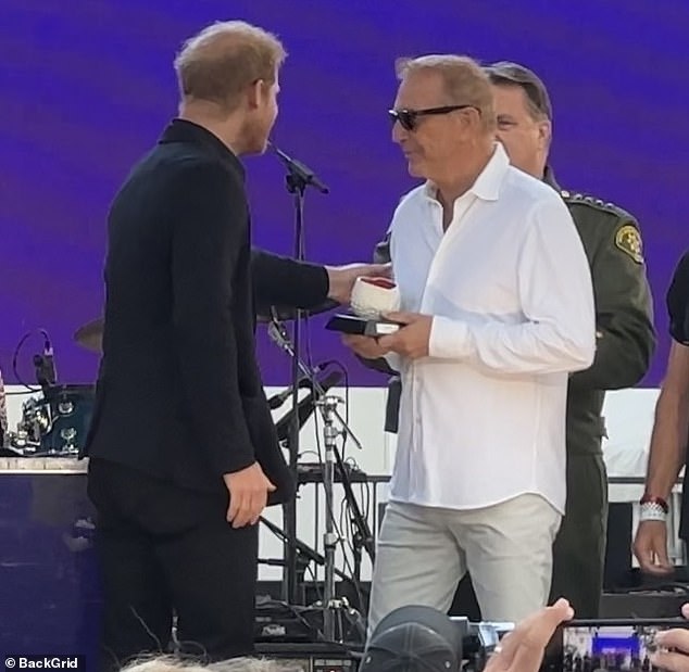 Pictured: Kevin Costner and Harry.  Harry and Meghan were introduced on stage as special guests and Meghan presented Kevin with an honorary award