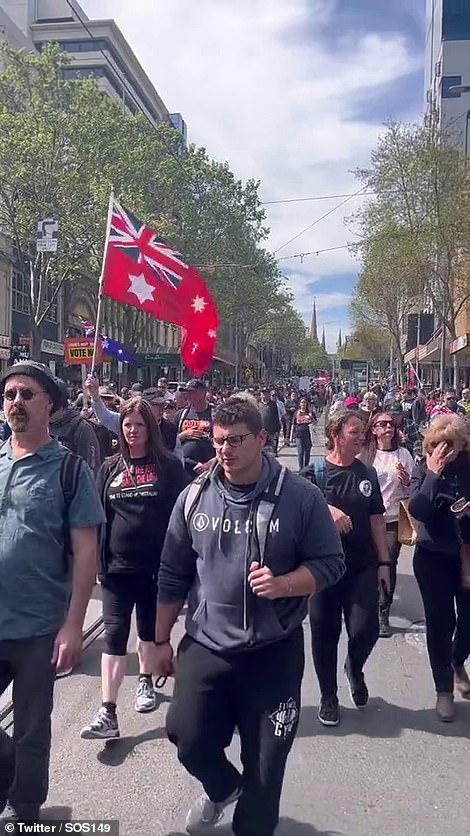 Protesters walk through central Melbourne